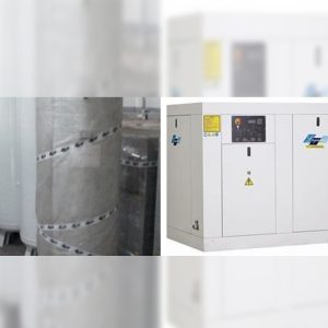 A white Screw Type Air Compressor (158 m3/h, 10 bar) with a control panel and warning signs stands beside large cylindrical tanks wrapped in protective material.