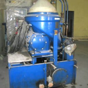 A 1 Set of Alfa Laval Oil Separator FOPX 614 is placed on a factory floor near a plastic-wrapped bench at a MAN HFO Power Plant, with cables and pipes attached.
