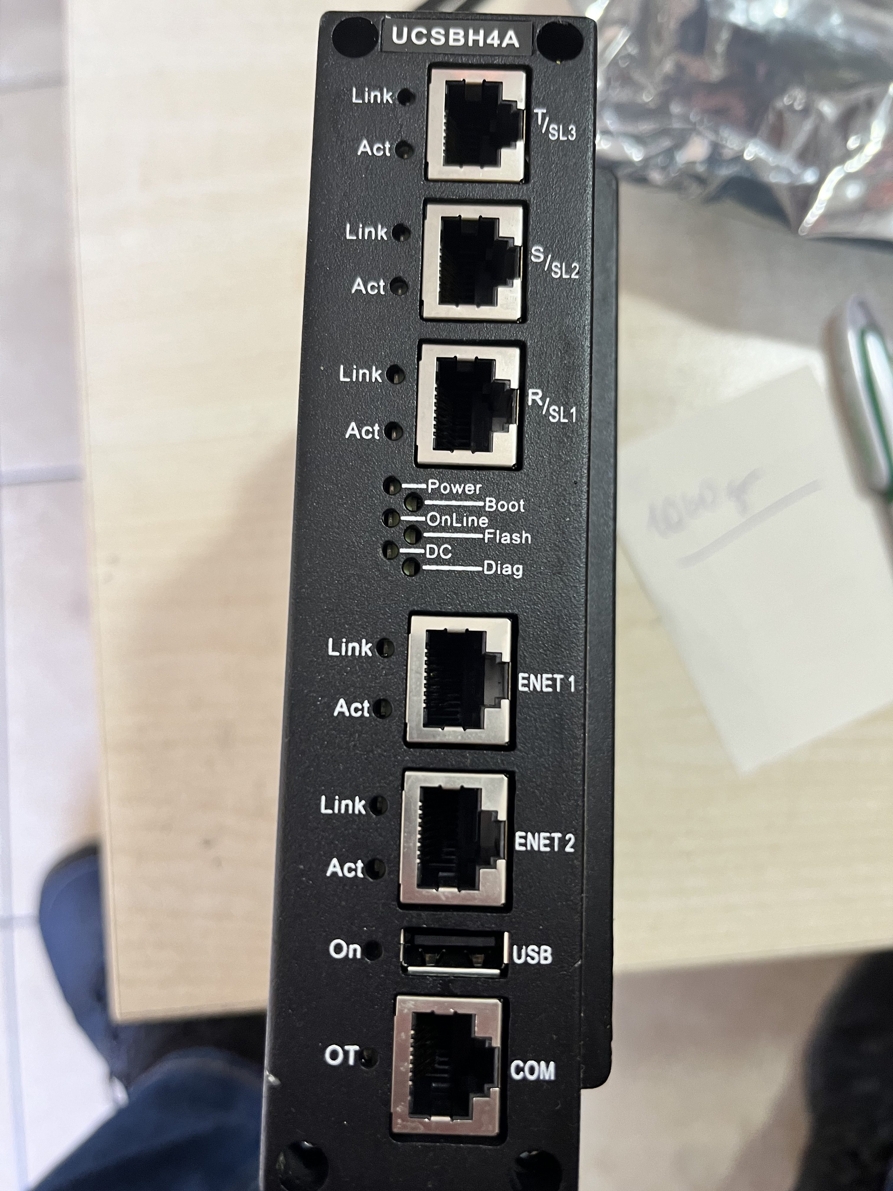 Close-up of a Used GE Energy IS420UCSBH4A UCSB CONTROLLER MODULE, commonly found in LM6000 gas turbine systems, with Ethernet, COM, USB ports, power LEDs, and indicator lights for link/activity status—all connections clearly labeled.