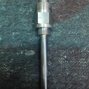 A Siemens Gas Turbine Wanted Igniter IG1-IG6 No. 64/51009011/4 is shown on a textured blue-green surface; its cylindrical body includes a hexagonal middle for easy wrench fitting, ideal for industrial turbine applications.