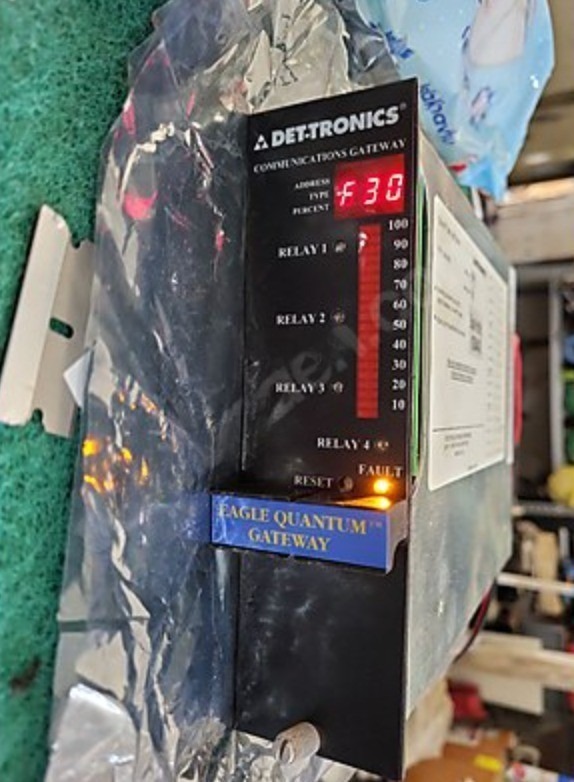A close-up of a refurbished Det-tronics EAGLE QUANTUM LOCAL CONTROL UNIT EQ2100LC LOGIC CONTROLLER shows a red F30 fault code on its display, with indicator LEDs lit and a blue Eagle Quantum Gateway label, commonly used in LM6000 gas turbine applications.