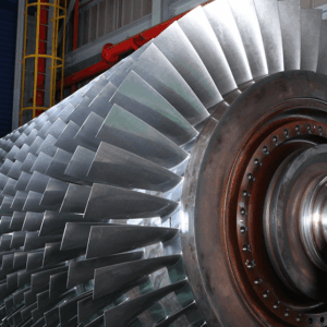 GT13DM - New and Refurbished GT13DM Capital Parts. Readily available and 1 week advance notice for inspection Close-up of the metal blades from New and Refurbished GT13DM Capital Parts, showing shiny, curved surfaces arranged in a precise circular pattern around the central hub.