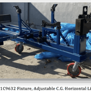 Two blue, wheeled metal fixtures with adjustable arms and locking mechanisms sit outdoors on a concrete surface, partially surrounded by blue plastic sheets. Label: LM6K1C9632-Fixture, Adjustable C.G. Horizontal-Lift.
