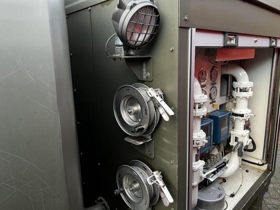 Close-up of the Available Refueller Refueler Tank 10000 m3, showing three large metallic valves and a panel with gauges, pipes, and controls, all within a 10,000 m3 compartment.